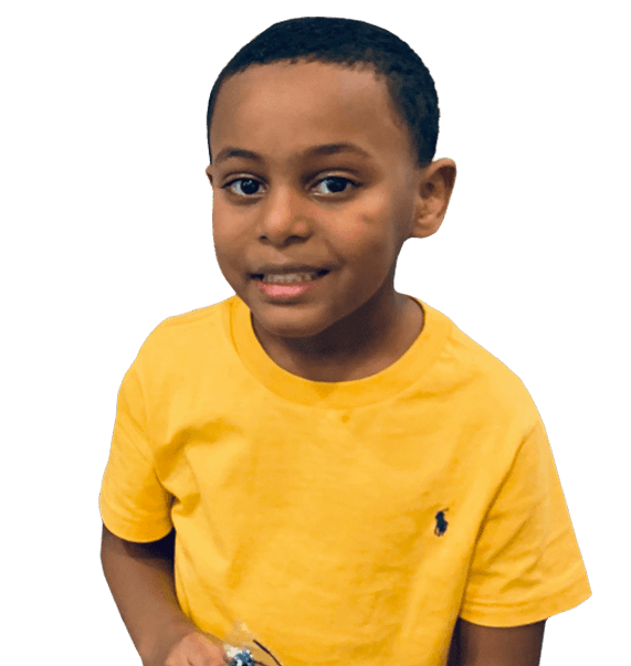 Smiling young boy wearing yellow shirt in Evanston