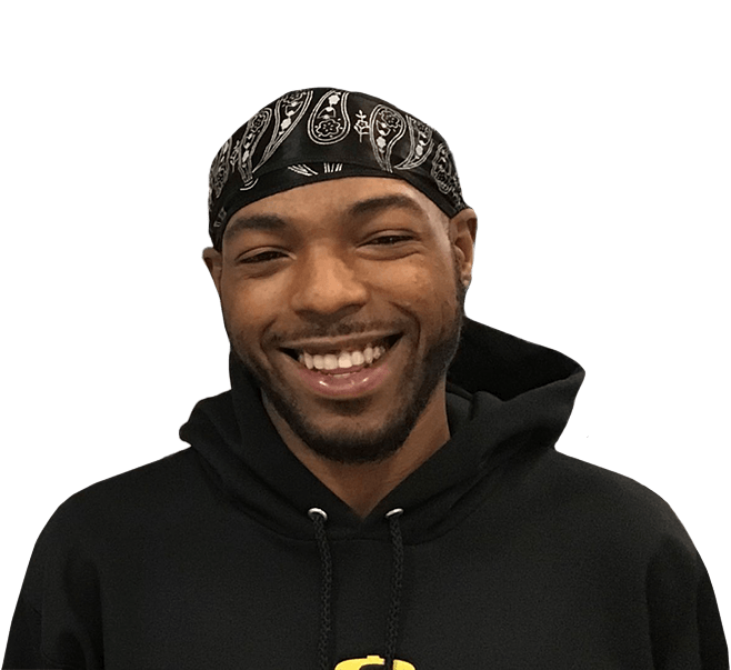 Young man smiling and wearing black hoodie in Evanston