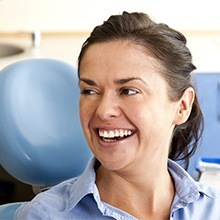 Woman smiling after CEREC dental crown treatment