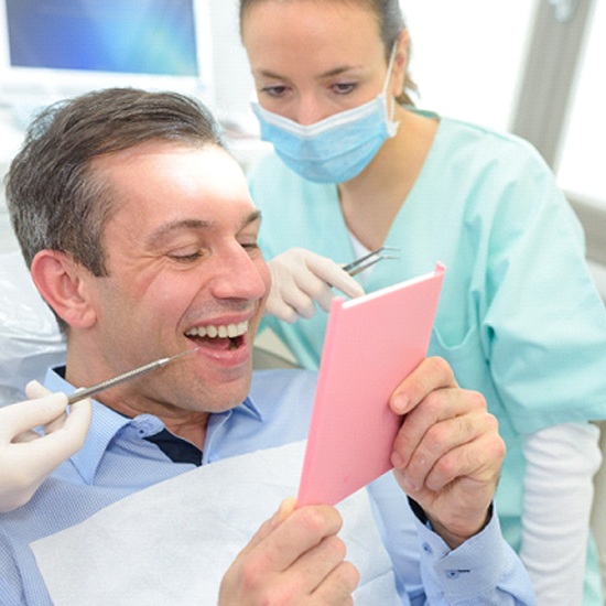 patient smiling with dental bridge