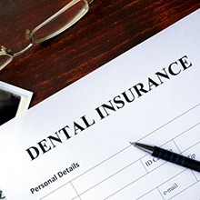A dental insurance form outlining the cost of dentures in Evanston