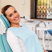 Smiling woman sitting in a dental chair