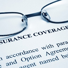 Glasses on top of insurance information form