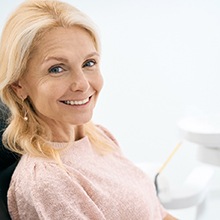 a patient smiling with her dental implants in Evanston
