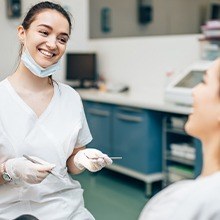 Dentist and patient discussing dental insurance coverage
