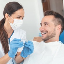 Patient and dentist discussing the cost of Invisalign in Evanston